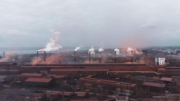A chimney chemical plant in the discharge of pollutants, Industry Pipes Pollute the Atmosphere With Smoke. download photo