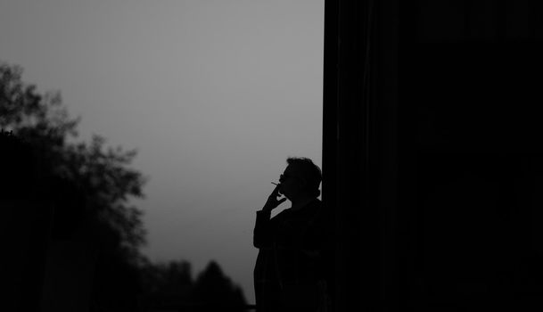 silhouette smoking woman. smoking cigarette on the street. stop smoking. download photo