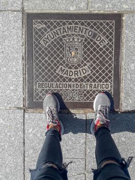 feet from above on the nameplate ayuntamiento de Madrid regulacion de trafico. download photo