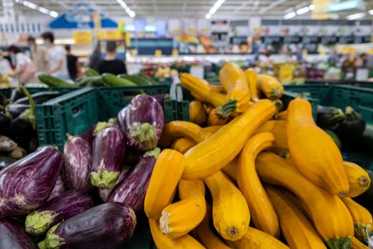 Close up Organic Long Purple Aubergine or Eggplant (Solanum melongena) and squash in the market. download photo