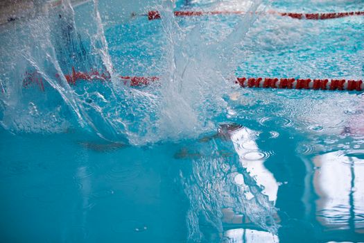 A man is swimming in the sports pool