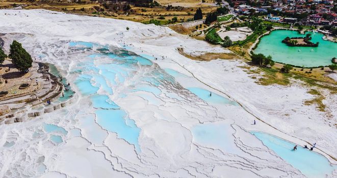Natural travertine pools and terraces in Pamukkale. Cotton castle and lake in southwestern Turkey - Pamukkale, Denizli. Travel background
