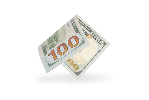 Hundred dollar bill falling casting shadow, half-folded bill close-up on white background.