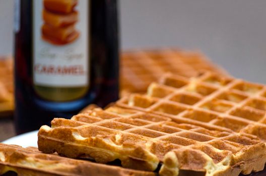 homemade belgian waffles, crispy waffles close-up on the table.