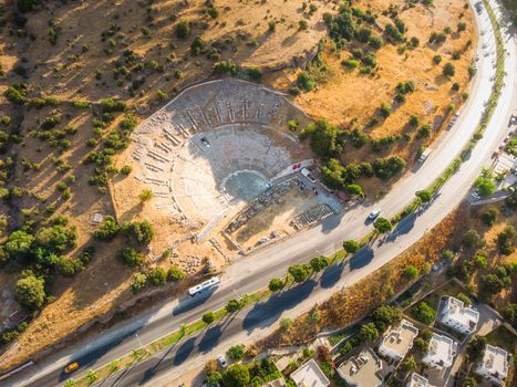 Aerial photo of historical places, theater ruins, massive ancient theatre of Halicarnassus, Bodrum, Turkey with highway crossing town. photo