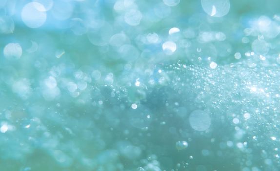 defocused abstract background with bubbles. Underwater bubbles with shiny blur through water surface, natural scene