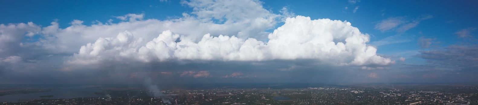 panorama of low blue sky and clouds. Sunset on huge clouds float on the blue sky. panorama sky