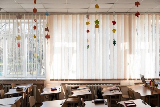 Empty School Class Room Interior. Going Back to School. Empty school classroom, no people. autumn decor in an empty classroom during the quarantine period covid. pandemic time covid-19 at school.