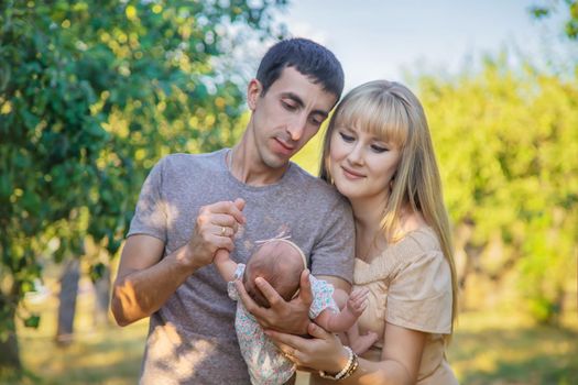 Family photo with a newborn baby. Selective focus. People.