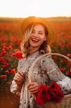 a girl in a dress with a hat and with a basket in a field with poppies.