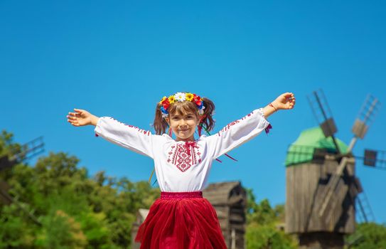 A child in a national Ukrainian costume. Selective focus. nature.