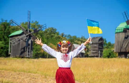 A child in a national Ukrainian costume. Selective focus. nature.