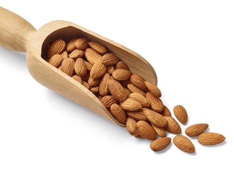 Close up of almonds on white background