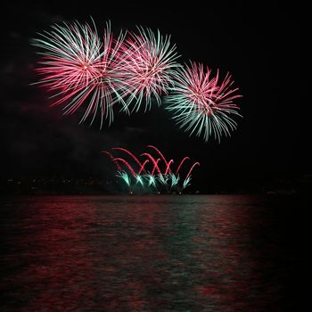 Beautiful colorful fireworks over the water. International fireworks competition Brno - Czech Republic.