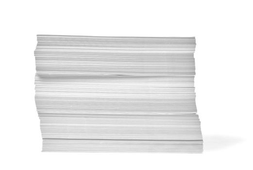 close up of a stack of paper on white background