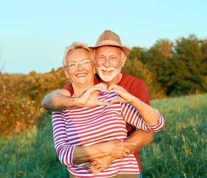 Happy active senior couple outdoors