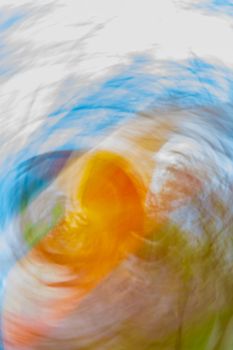 Abstract vertical background with colorful swirls and blur. Orange, blue, green, gray colors. Backdrop