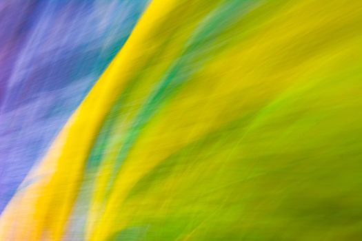 Abstraction in yellow blue green colors. The background is covered with small ripples. Backdrop