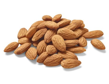 Close up of almonds on white background