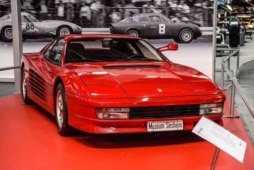 SINSHEIM, GERMANY - MAI 2022: red Ferrari Testarossa sports car 1988 390ps