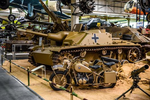 SINSHEIM, GERMANY - MAI 2022: sand military Sturmgeschutz StuG III 3 assault gun and motorbike motorcycle BMW R75 WW2 3rd reich nazi Germany