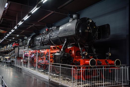 SINSHEIM, GERMANY - MAI 2022: black red antique retro steam locomotive.