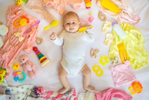 Baby with clothes and accessories. Selective focus. People.