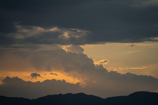 colorful sunset sky and clouds evening on mountain. Sky and clouds natural sunset orange sunbeam light backgrounds nature