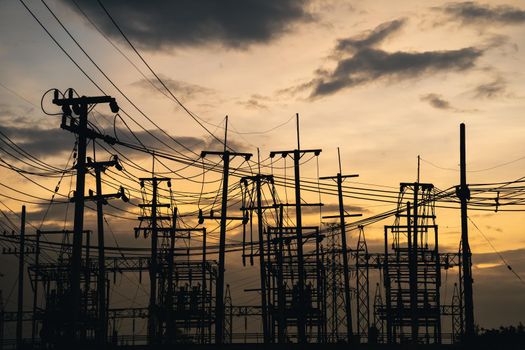 high voltage post.High voltage tower at power plant sunset evening golden time  sky background