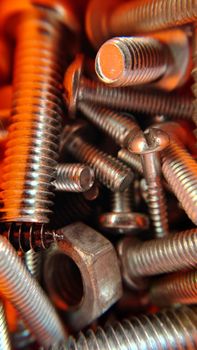 Macro.Background image of different bolts nuts screws .Texture or background