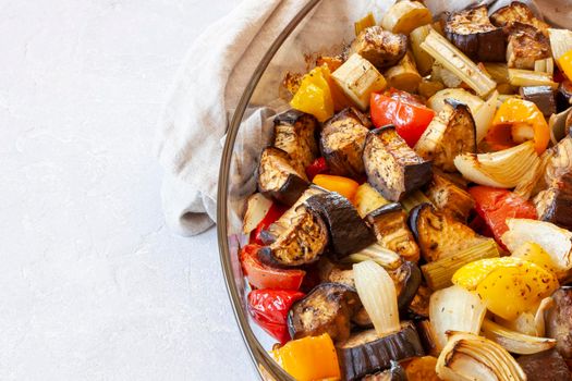 baking dish with baked vegetables closeup, top view, copy space