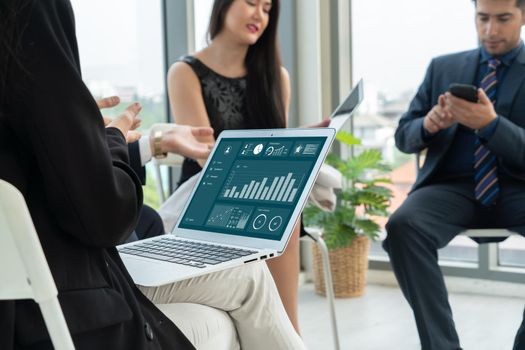 Business data dashboard analysis by ingenious computer software . Investment application display business sales and profit on the computer screen and advise marketing planning decision .