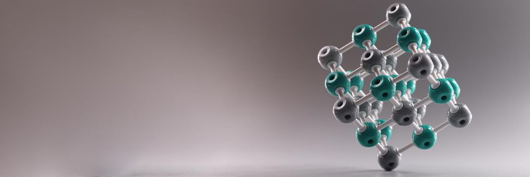 Plastic molecule in shape of square on gray background. Atomic chemistry concept