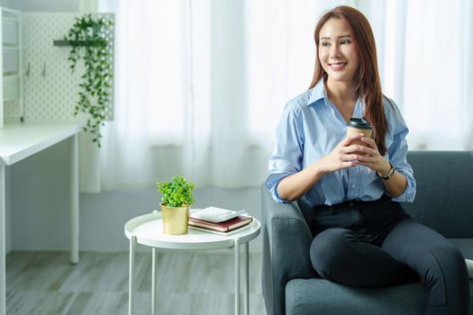 Entrepreneurs, Business Owners, Accountants, Portrait of a Small Business Startup Asians hold happy smiling faces while drinking coffee while taking a break from work