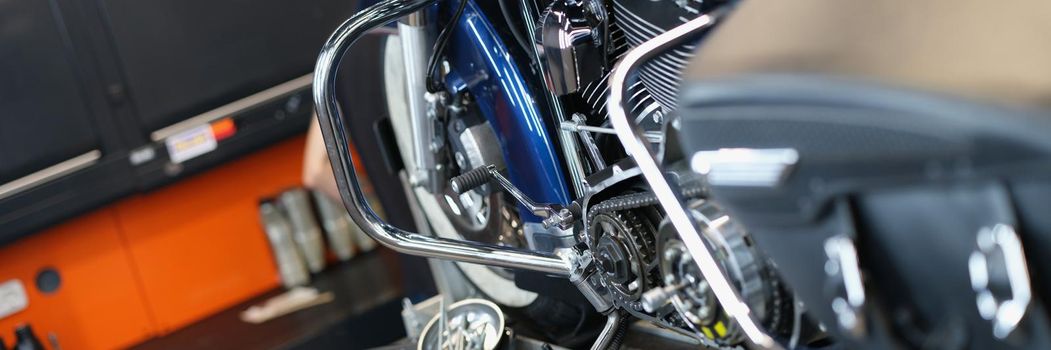 Motorcycle and parts in the garage kitchen, close-up. Pedal replacement, transmission tuning, upgrade motorbike