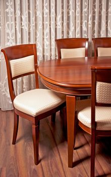 Contemporary dining room, a table with chairs in the foreground.