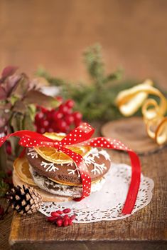 Christmas decoration with cookies and spices on an old wooden background.