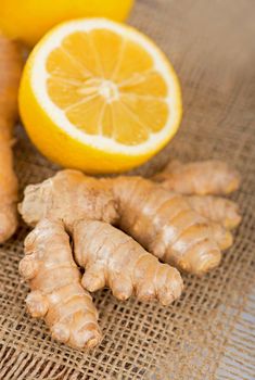 Ginger with mint and lemon on table