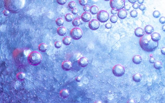 water drops on purple background. colored abstract background. colorful design