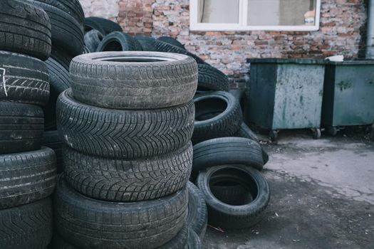 pile of old tire . used tires at the dumpster. stack tyres. renewal tires