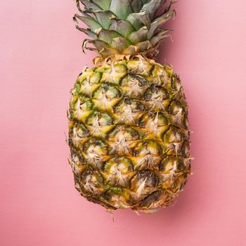 Hawaiian pineapple set, on pink textured summer background, top view flat lay