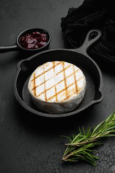 Oven Backed camembert, on black dark stone table background