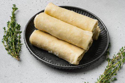 Crepes frozen, on gray stone table background