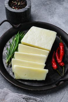Cyprus Halloumi cheese, on gray stone table background