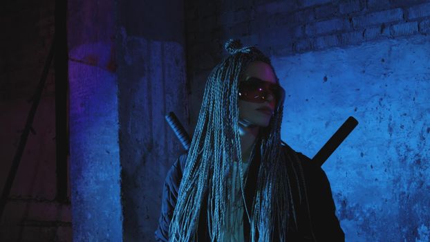 girl with dreadlocks and katanas in red glasses posing against a neon brick wall 4k