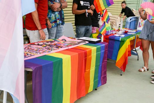 Santa Pola, Alicante, Spain- July 2, 2022: Merchandise Stands selling flags and other items at the Gay Pride Festival in Santa Pola