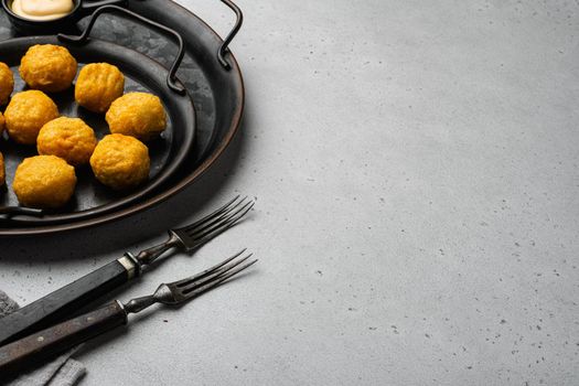 Battered meat, on gray stone table background, with copy space for text