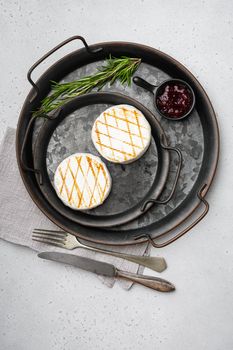 Homemade Baked Camembert cheese, on gray stone table background, top view flat lay