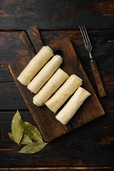 Crepes frozen, on old dark wooden table background, top view flat lay
