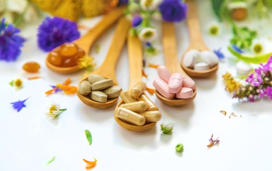 Homeopathy and dietary supplements from medicinal herbs. Selective focus. Nature.